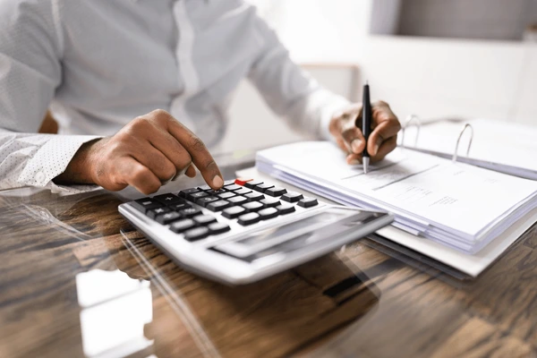 african american accountant auditor calculator 600nw 2180854093.webp